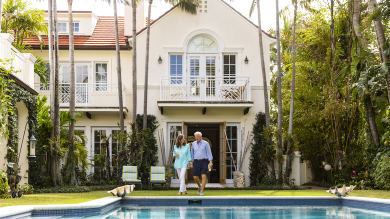 Wealthy couple in home.