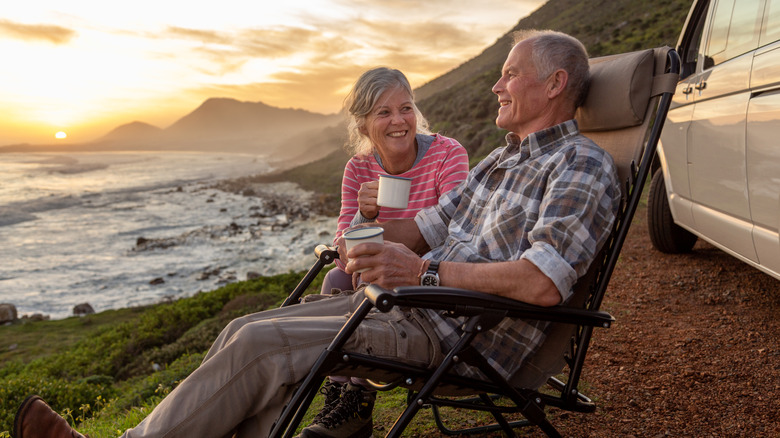 shot of smiling senior couple at the beach