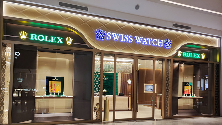 Exterior view of a luxury Rolex and Swiss Watch store in a mall